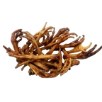 Dried roots on a white plate with a white background