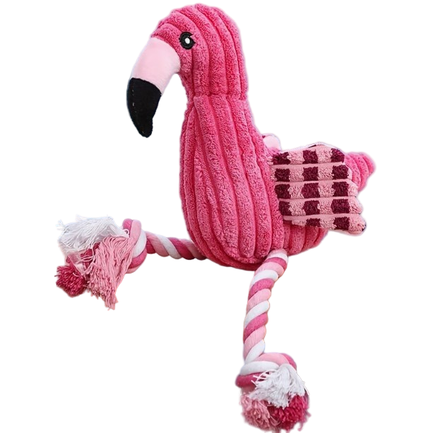 Pink flamingo toy with a rope on a wooden surface against a light blue curtain background