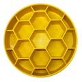 Yellow plastic tray with honeycomb design on a white background