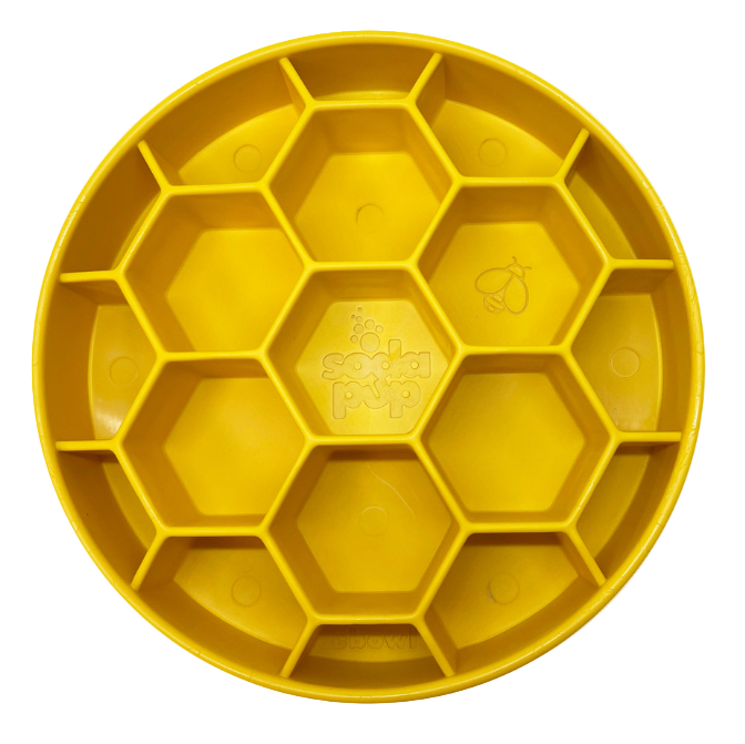Yellow plastic tray with honeycomb design on a white background
