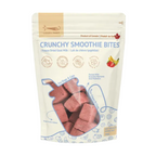 A stand-up pouch of L'Logy-Paws Crunchy Smoothie Bites dog and cat treats, featuring a cream-colored package with blue text and graphics, and a clear window showing the pinkish-red freeze dried treats inside.