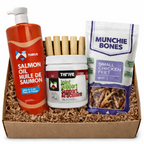 Box containing Thrive salmon oil, joint support supplement, and Munchie Bones chicken feet packaging.