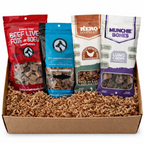 Box of dog treats from various brands on a white background